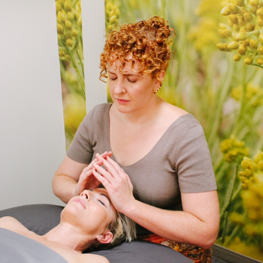 Massage therapist performing Craniosacral Therapy